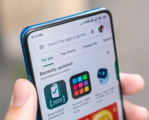 Photo of an android phone with the Google Play Store open
